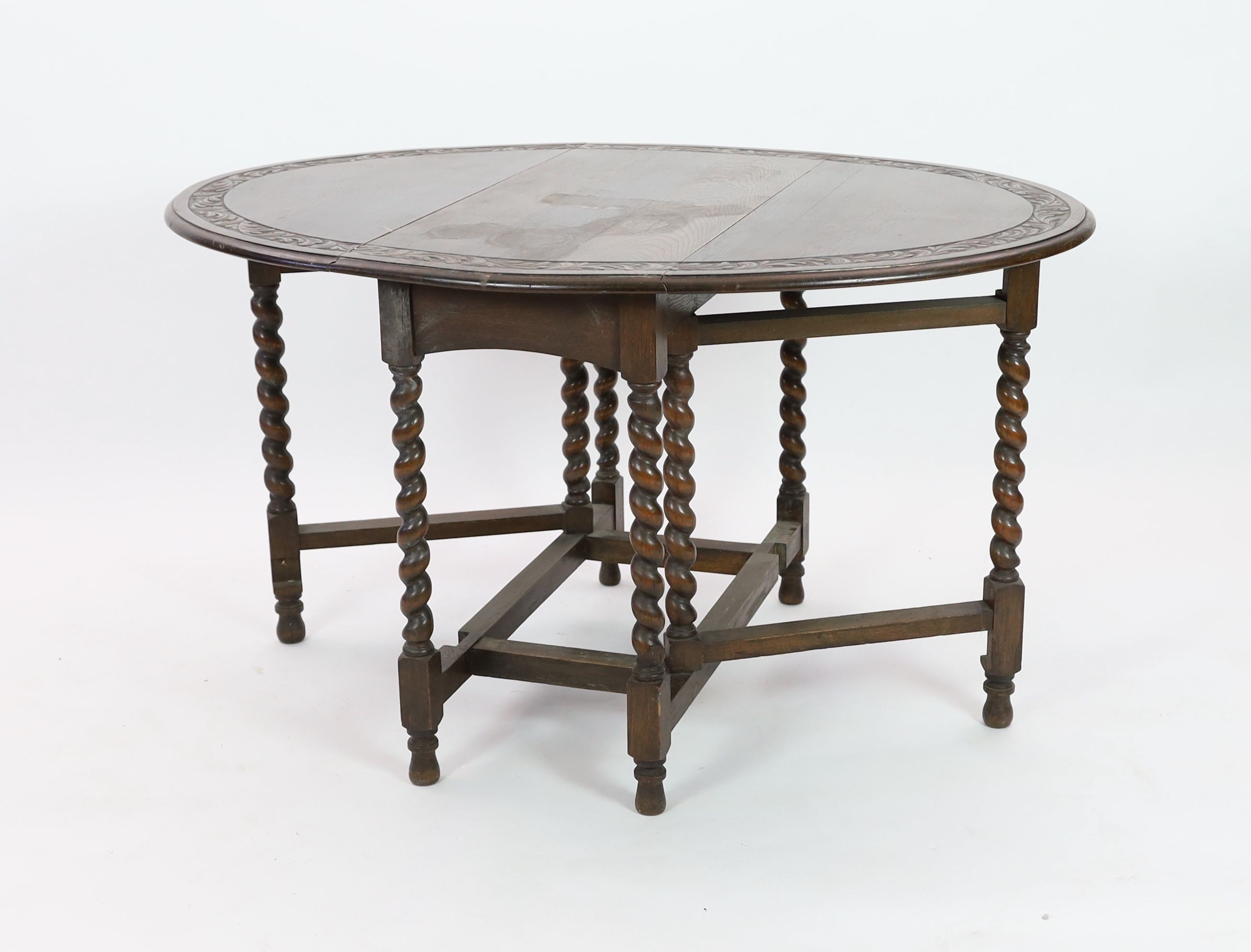 An early 20th century 18th century style oak gateleg dining table, width 98cm depth 46cm height 76cm